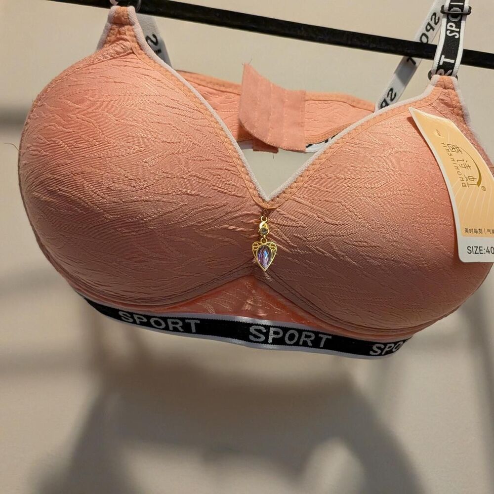 Pink lace bra with textured surface, size 40